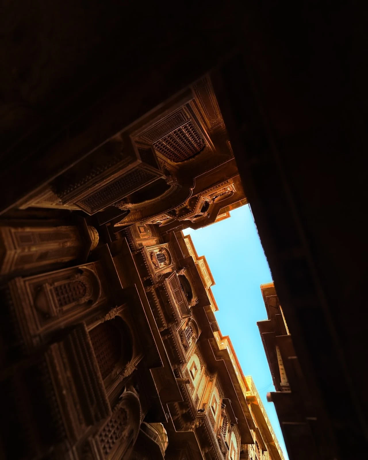 An arched window framing a Jaisalmer lane